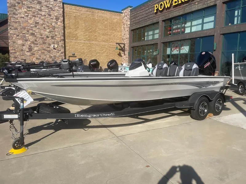 The Image of 2025 Ranger ALPHA 208 boat on trailer outside a store. - 0
