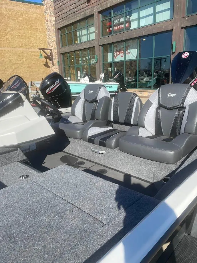 Slide: The Image of 2025 Ranger ALPHA 208 boat interior with modern seating and sleek design. - 2