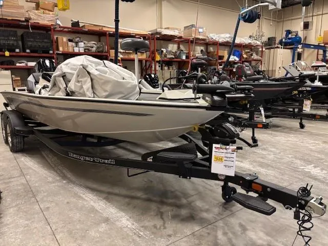 Slide: The Image of 2025 Ranger ALPHA 208 boat in showroom, covered and on trailer. - 2