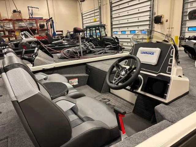 Slide: The Image of Interior of 2025 Ranger ALPHA 208 boat with steering wheel and Lowrance display. - 3