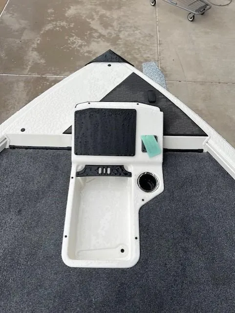 Slide: The Image of 2025 Ranger ALPHA 208 boat console with a sleek design and integrated cup holder. - 7