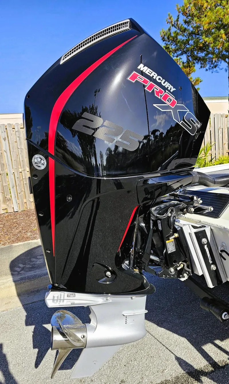 Slide: The Image of 2025 Ranger ALPHA 208 with Mercury Pro XS outboard motor, sleek black and red design. - 7