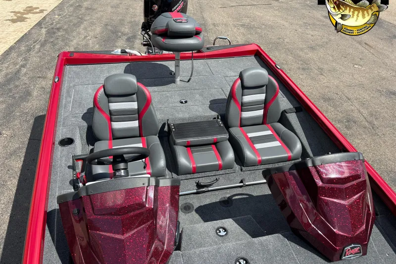 Slide: The Image of 2025 Ranger RT188P boat interior with red and gray seating, steering wheel, and console. - 8