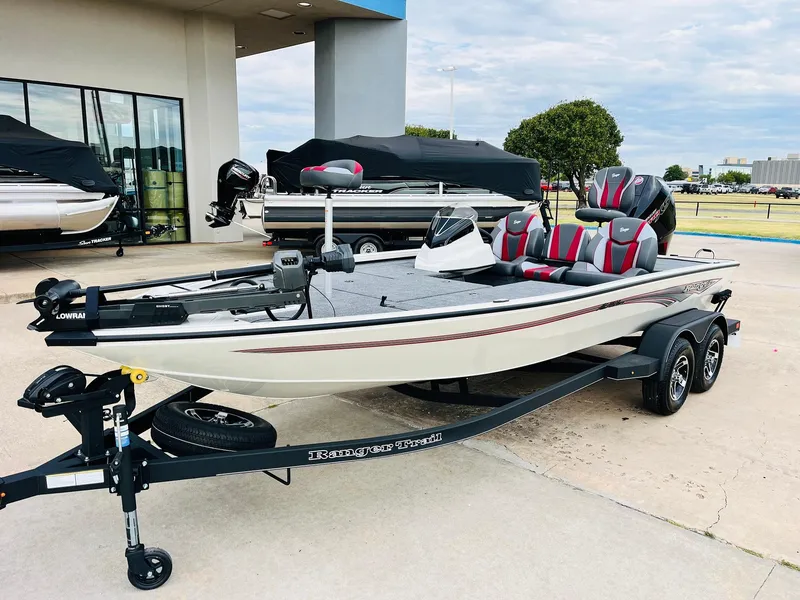 Slide: The Image of 2025 Ranger ALPHA 208 fishing boat on trailer, parked outdoors. - 1