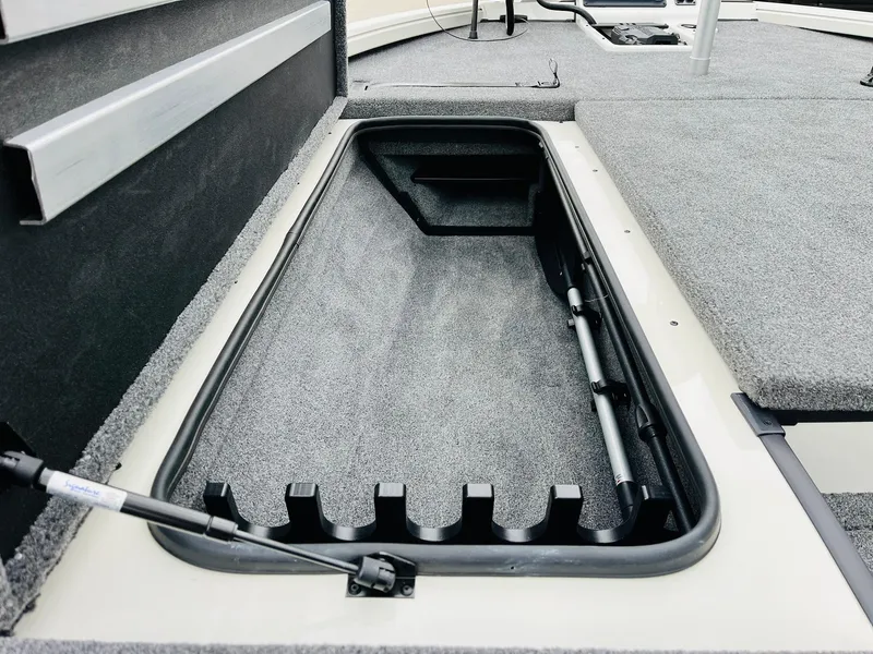 Slide: The Image of Ranger ALPHA 208 boat storage compartment, 2025 model, with carpeted interior and hydraulic lift. - 16
