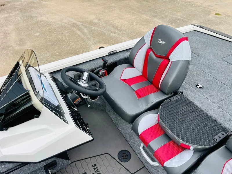 Slide: The Image of 2025 Ranger ALPHA 208 boat interior with red and gray seating. - 28