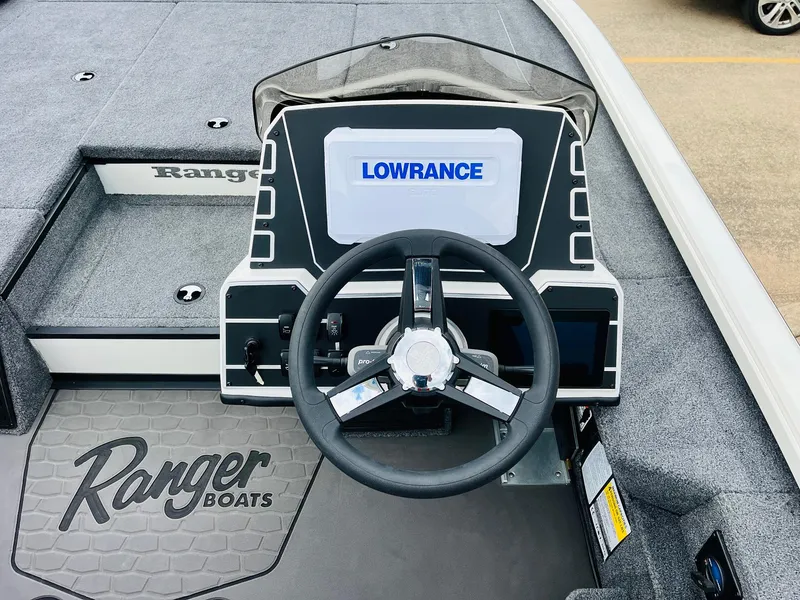 Slide: The Image of 2025 Ranger ALPHA 208 boat dashboard with Lowrance display and steering wheel. - 30