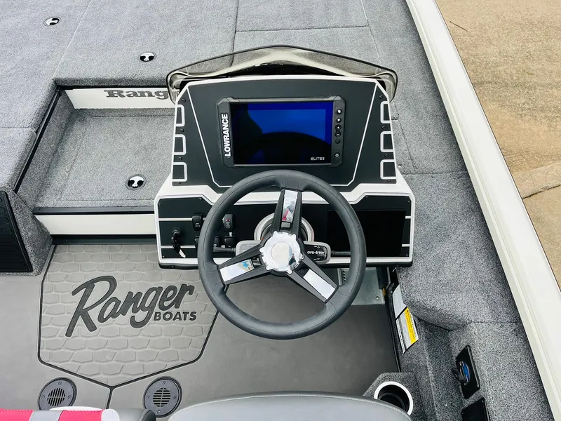 Slide: The Image of Ranger ALPHA 208 boat dashboard with steering wheel and navigation screen, 2025 model. - 31