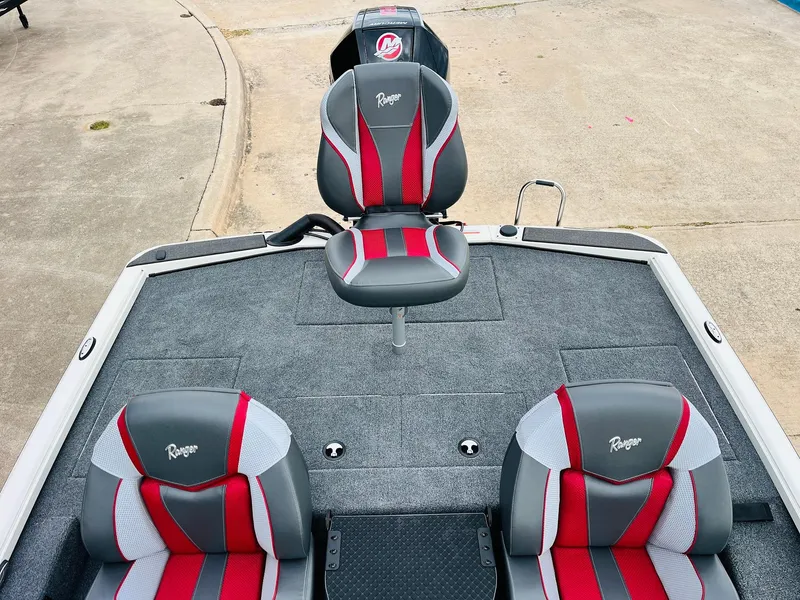 Slide: The Image of 2025 Ranger ALPHA 208 boat interior with red and gray seating. - 35