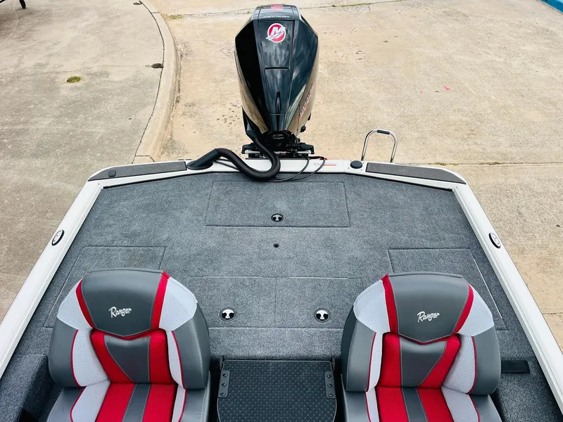 Slide: The Image of 2025 Ranger ALPHA 208 boat interior with dual seats and motor. - 36