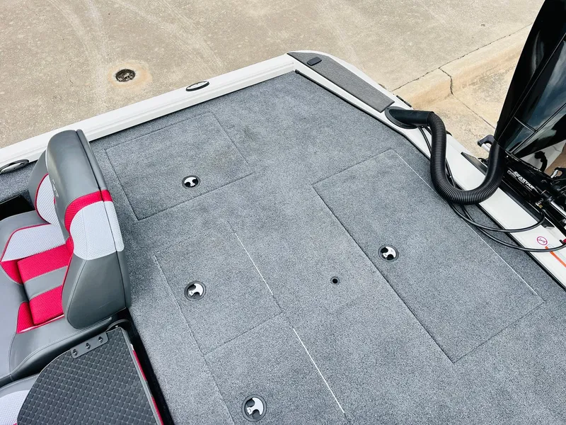 Slide: The Image of Ranger ALPHA 208 boat deck, 2025 model, featuring gray carpet and seating. - 43