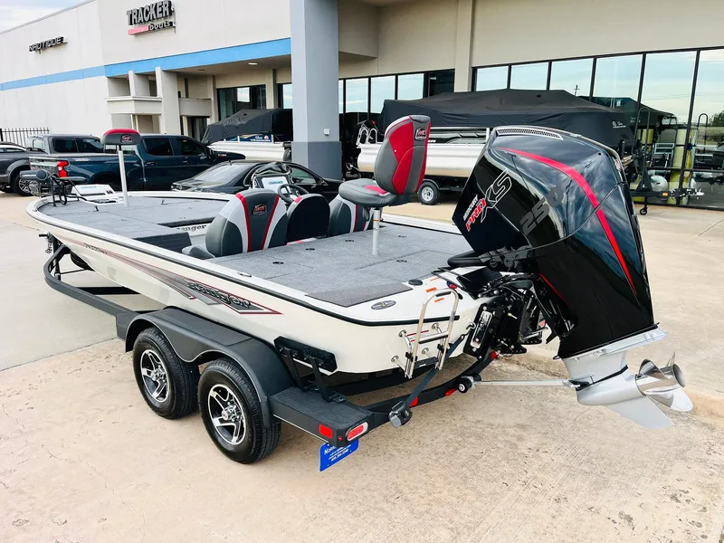 Slide: The Image of 2025 Ranger ALPHA 208 boat with dual axle trailer and powerful outboard motor. - 6