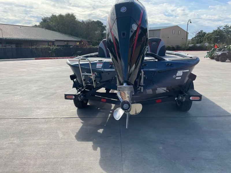 Slide: The Image of 2025 Ranger ALPHA 208 boat on trailer, rear view, outdoor setting. - 7