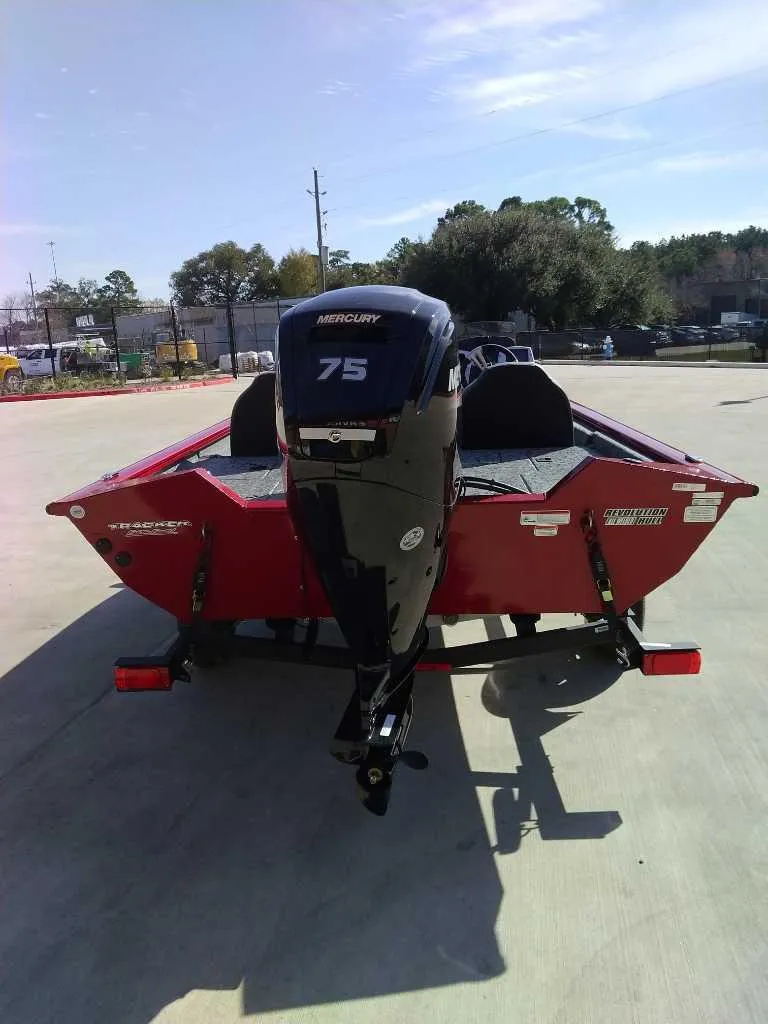 Slide: The Image of 2025 Tracker Pro Team 175 boat with Mercury 75 engine, parked outdoors. - 3