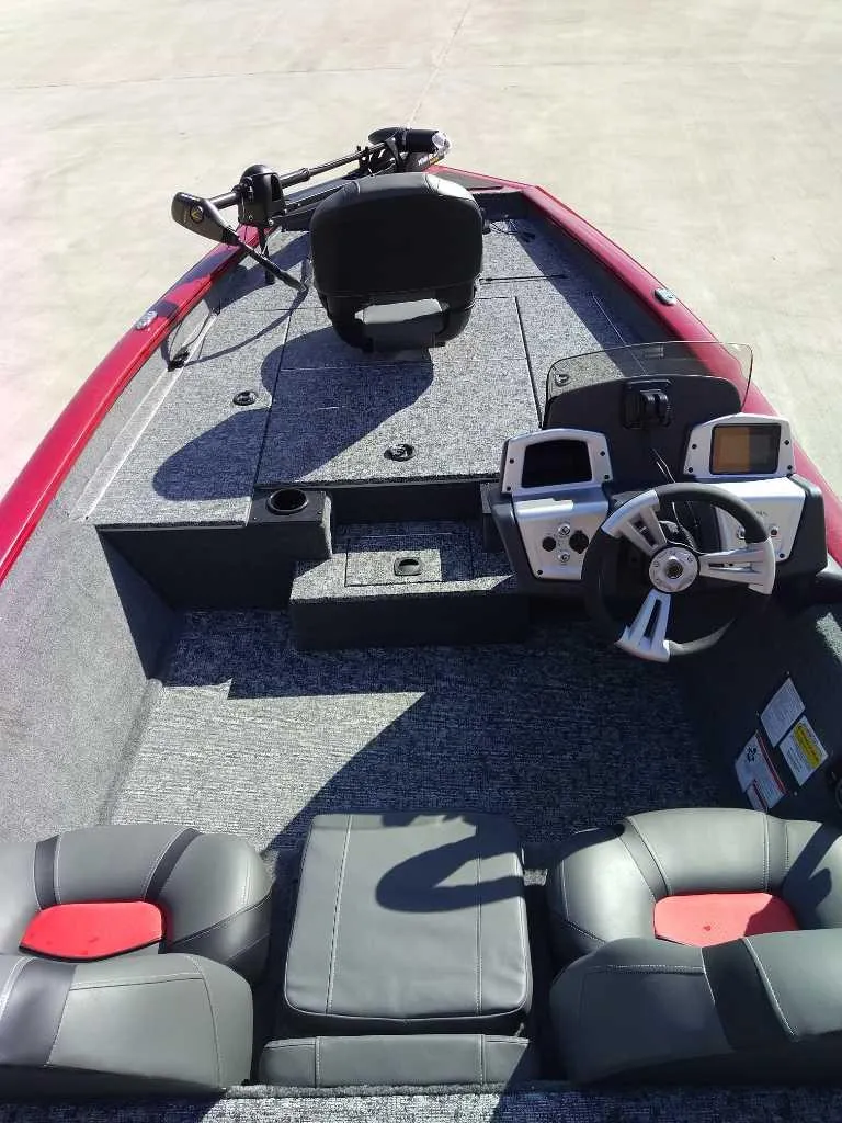 Slide: The Image of 2025 Tracker Pro Team 175 boat interior with modern dashboard and seating. - 4