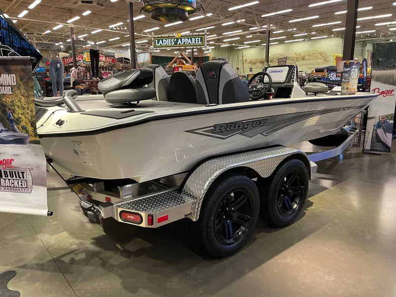Slide: The Image of 2025 Ranger ALPHA 208 boat on display in a showroom with modern interior design. - 4