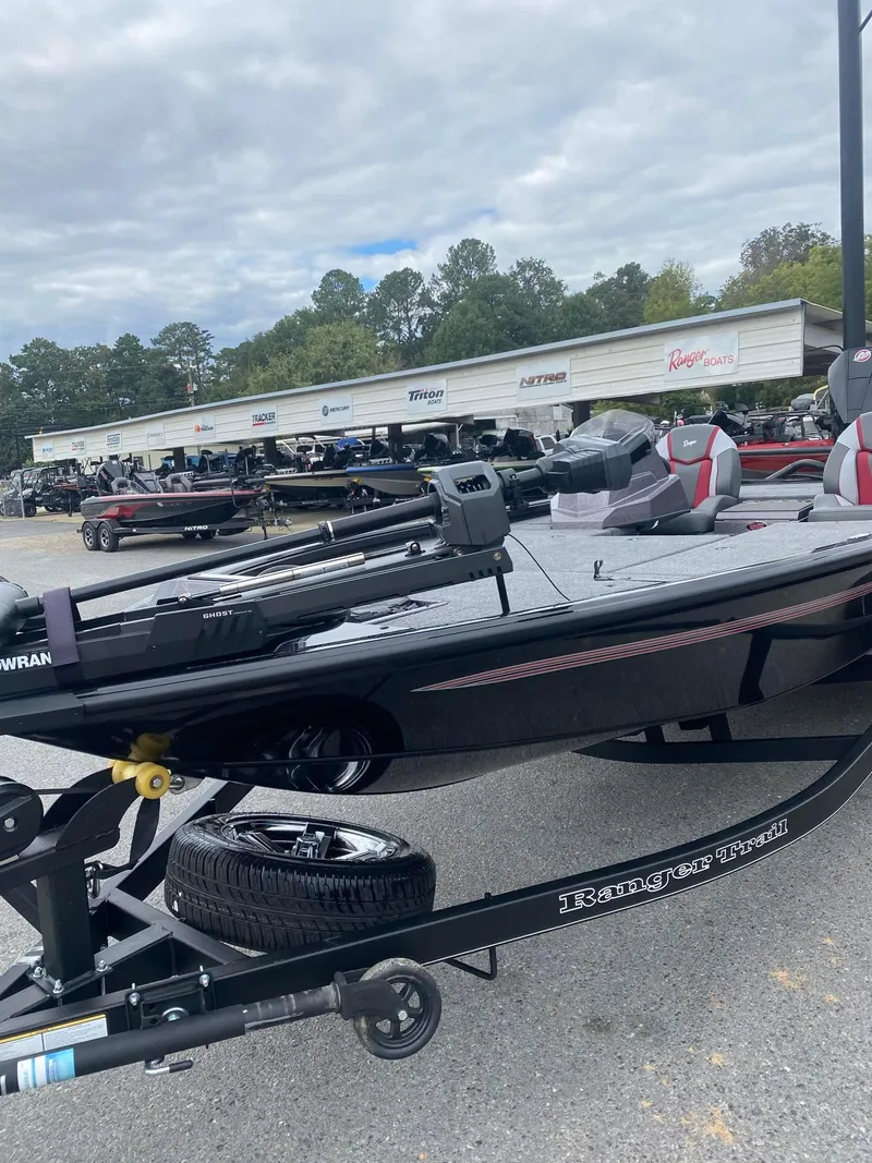 Slide: The Image of 2025 Ranger ALPHA 208 boat on trailer in dealership lot. - 5