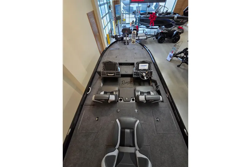 Slide: The Image of 2025 Ranger ALPHA 208 boat interior with modern dashboard and seating. - 84