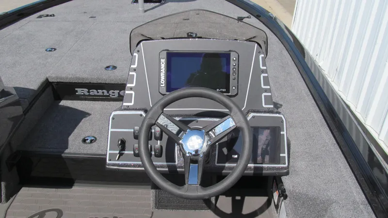 Slide: The Image of Ranger ALPHA 208 boat dashboard with steering wheel and navigation display, 2025 model. - 6