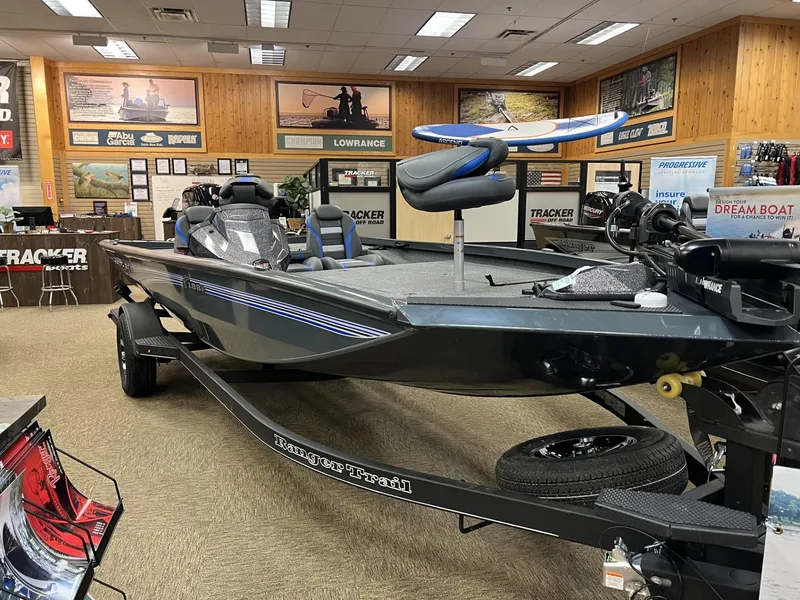 The Image of 2025 Ranger RT188P boat displayed in showroom with fishing equipment. - 0