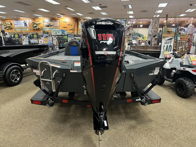 Slide: The Image of 2025 Ranger RT188P boat with Mercury 115 engine displayed indoors. - 2