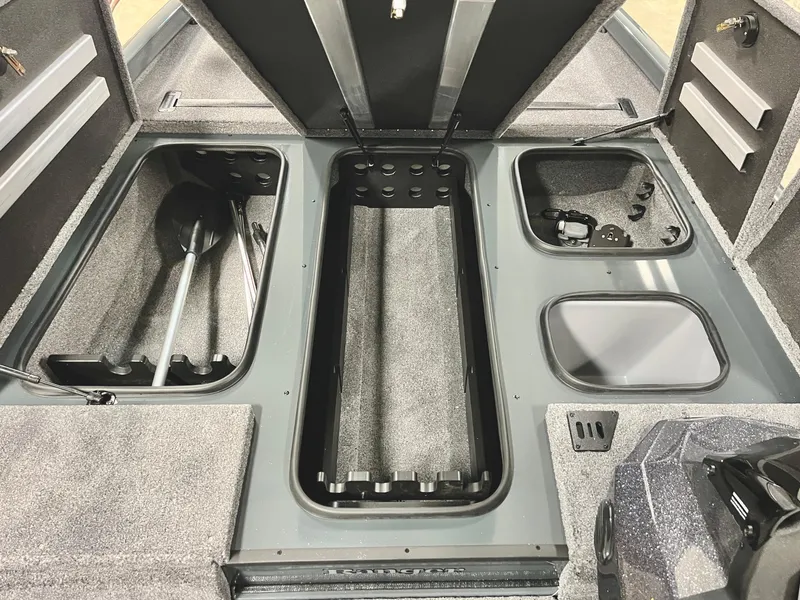 Slide: The Image of 2025 Ranger RT188P boat storage compartments with organized fishing gear. - 11
