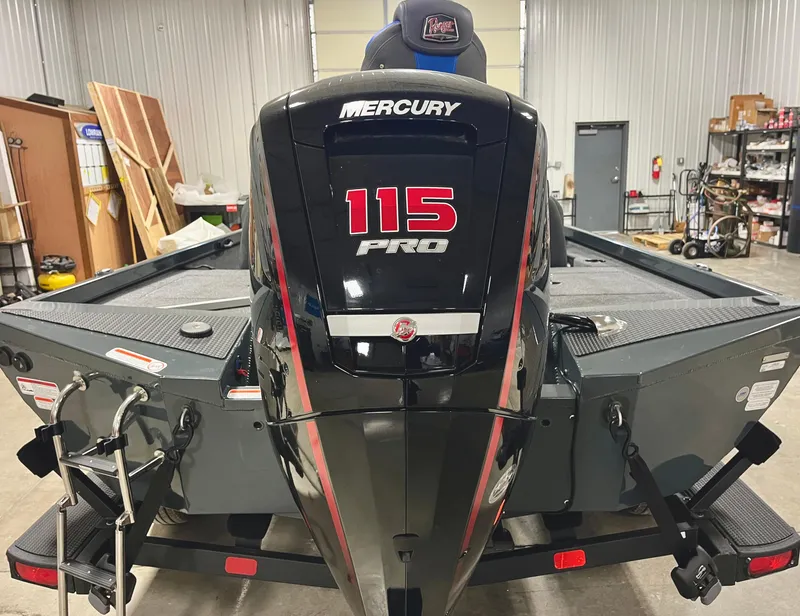 Slide: The Image of 2025 Ranger RT188P boat with Mercury 115 Pro outboard motor in a garage. - 6