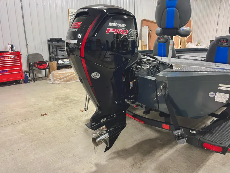 Slide: The Image of 2025 Ranger RT188P boat with Mercury Pro XS 115 outboard motor in a garage. - 7