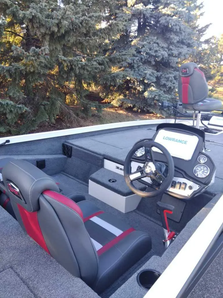 Slide: The Image of 2025 Ranger RT198P boat interior with steering wheel and seating, featuring Lowrance electronics. - 4