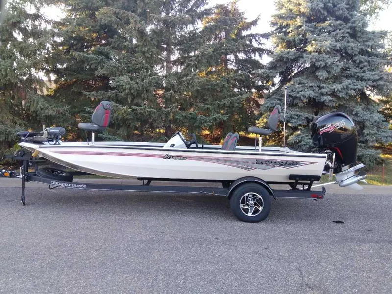 Slide: The Image of 2025 Ranger RT198P fishing boat on trailer, parked outdoors. - 8