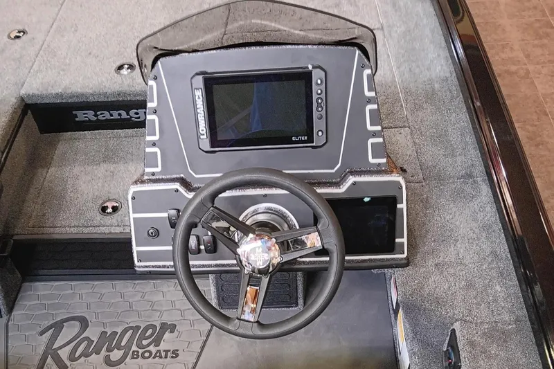 Slide: The Image of Ranger ALPHA 208 boat dashboard with steering wheel and navigation display, 2025 model. - 4