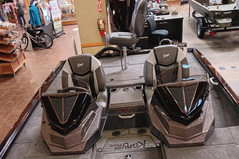 Slide: The Image of 2025 Ranger ALPHA 208 boat interior with dual seats and steering consoles. - 6