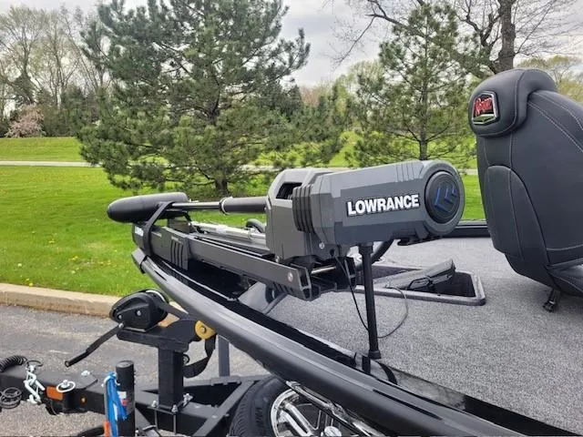 Slide: The Image of 2025 Ranger ALPHA 208 boat with Lowrance equipment, parked on a trailer. - 2