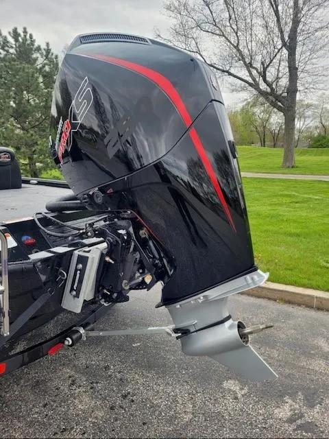 Slide: The Image of 2025 Ranger ALPHA 208 outboard motor, sleek black design with red accents, parked outdoors. - 3