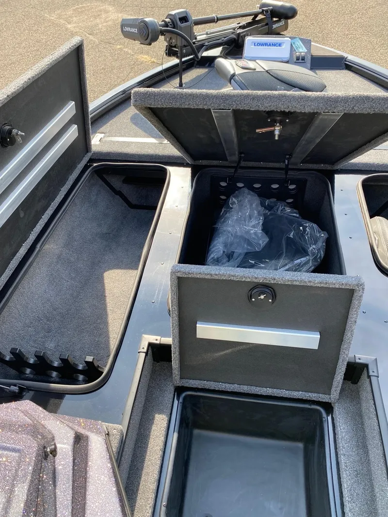 Slide: The Image of 2025 Ranger ALPHA 208 boat storage compartments and control panel. - 10