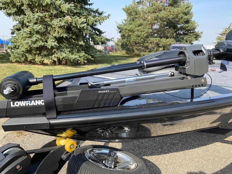 Slide: The Image of Ranger ALPHA 208 boat with Lowrance Ghost trolling motor, 2025 model, parked outdoors. - 4