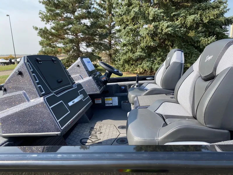 Slide: The Image of 2025 Ranger ALPHA 208 boat interior with dual seats and control panel. - 5