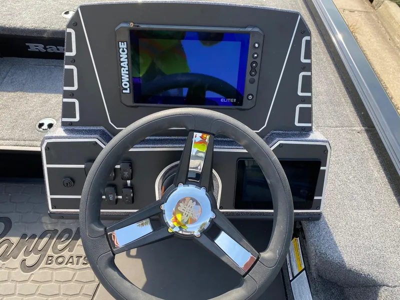 Slide: The Image of 2025 Ranger ALPHA 208 boat dashboard with Lowrance Elite display and steering wheel. - 6