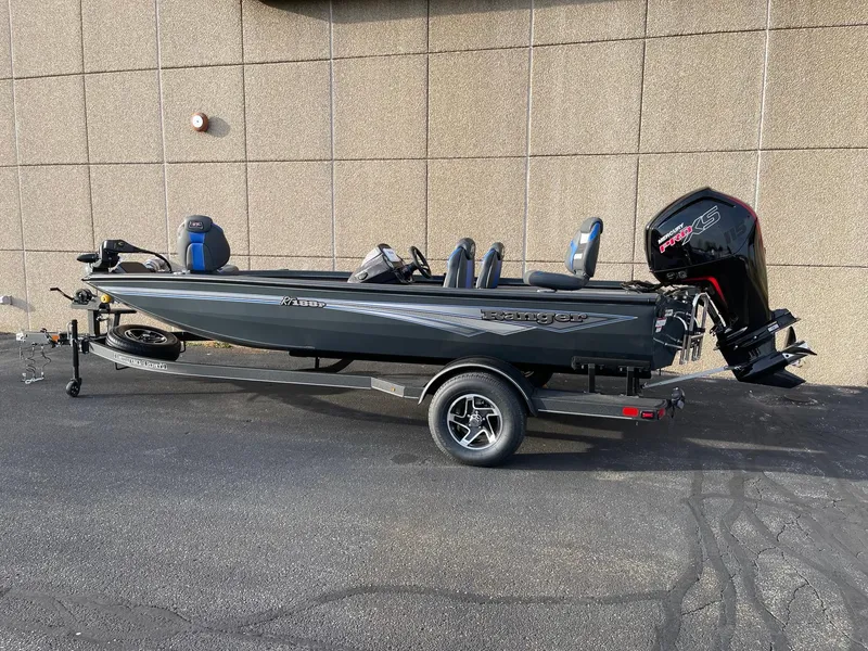 The Image of 2025 Ranger RT188P fishing boat on trailer, parked outdoors. - 0