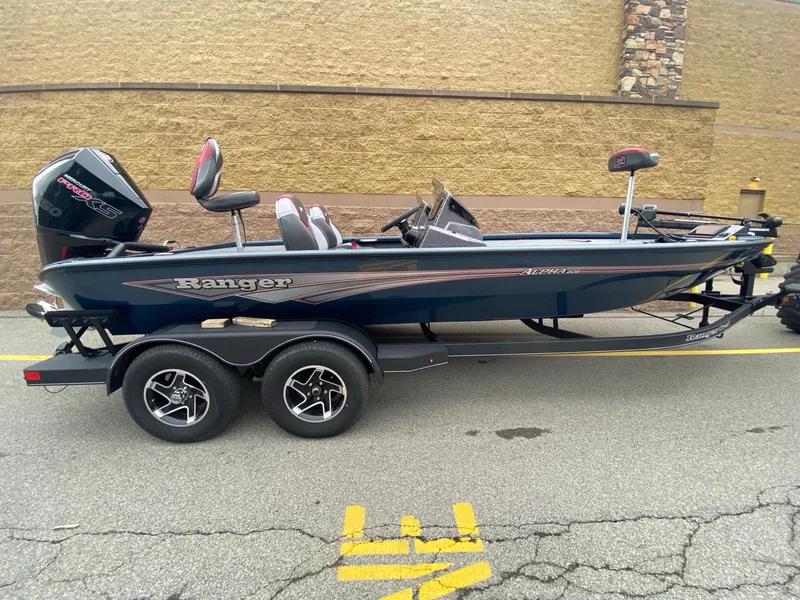The Image of 2025 Ranger ALPHA 208 boat on trailer, side view, parked on street. - 0