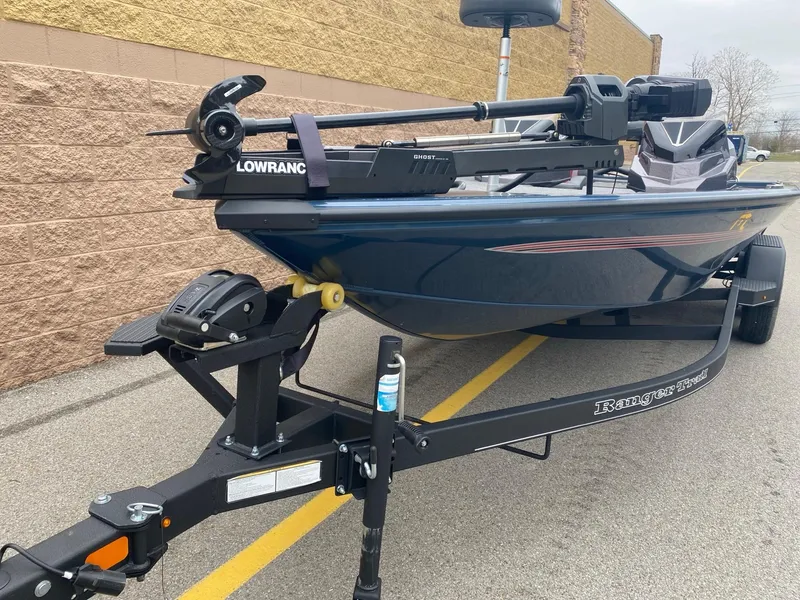 Slide: The Image of 2025 Ranger ALPHA 208 boat on trailer, featuring Lowrance equipment, parked outdoors. - 3
