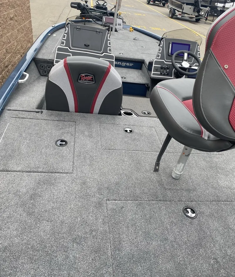 Slide: The Image of 2025 Ranger ALPHA 208 boat interior with modern seating and control panel. - 5