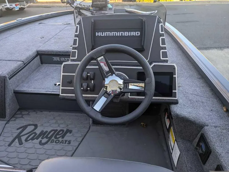 Slide: The Image of 2025 Ranger ALPHA 208 boat dashboard with Humminbird electronics and steering wheel. - 6