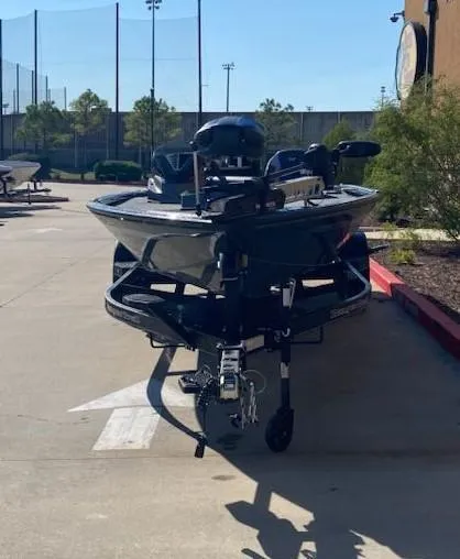 Slide: The Image of 2025 Ranger ALPHA 208 boat on trailer in outdoor setting. - 2