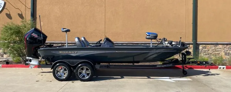 Slide: The Image of 2025 Ranger ALPHA 208 boat, sleek design, parked on a trailer outdoors. - 4