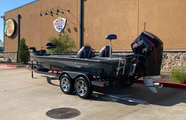 Slide: The Image of 2025 Ranger ALPHA 208 boat on trailer, parked outside a store. - 5