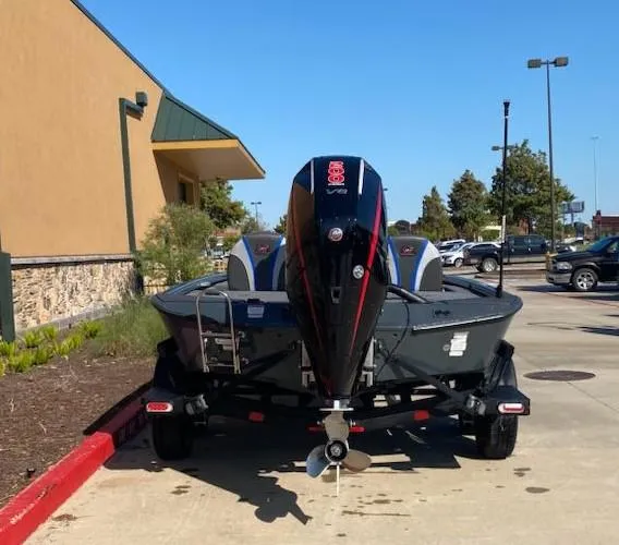 Slide: The Image of 2025 Ranger ALPHA 208 boat on trailer in parking lot, rear view. - 6