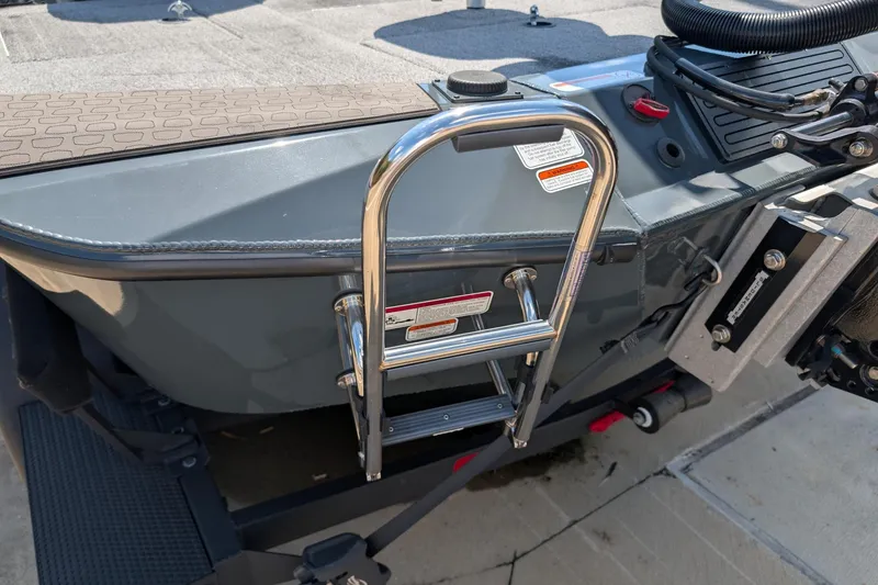 Slide: The Image of Stainless steel ladder on 2025 Ranger ALPHA 208 boat, docked on a sunny day. - 10