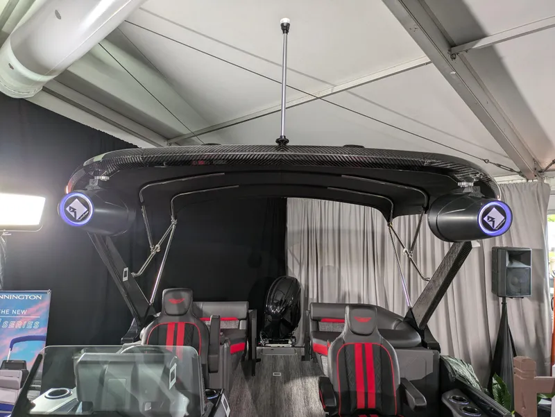 Slide: The Image of 2025 Bennington M Line boat dashboard with steering wheel and digital displays. - 10