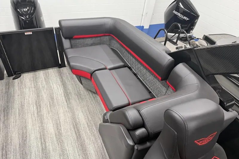 Slide: The Image of 2025 Bennington M Line boat interior with sleek gray and red seating. - 11
